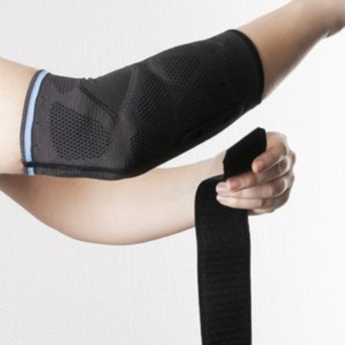 Armbågsskydd Dynamics Plus med dubbelsidig avlastning för tennisarm, golfarm och musarm
